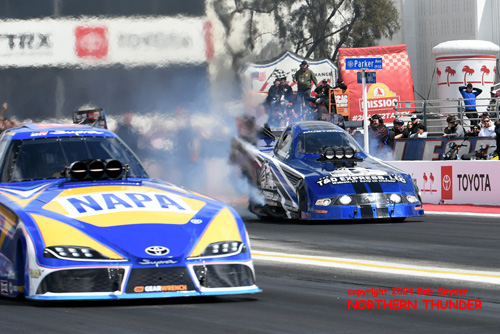 Ron Capps (near lane) vs 
Terry Haddock (far lane)
